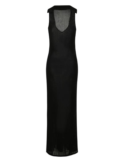 The ABRIL DRESS - BLACK by TIGERMIST is a long, sleeveless black dress with a semi-sheer texture. This elegant piece features a V-neckline and a fitted design that extends to the ankles, showcasing a minimalist and sophisticated style.